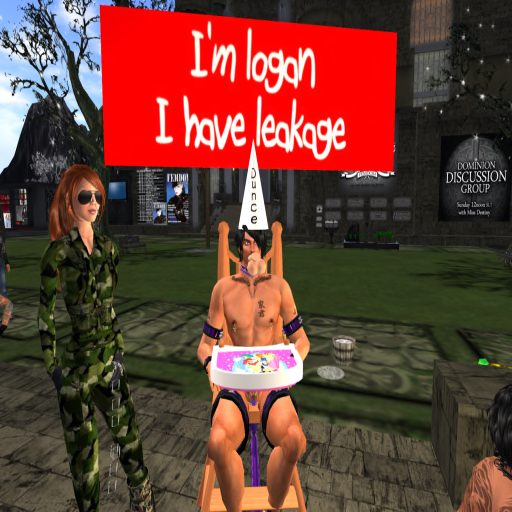 Pamela Emmons in camouflage beside a sub in a dunce cap